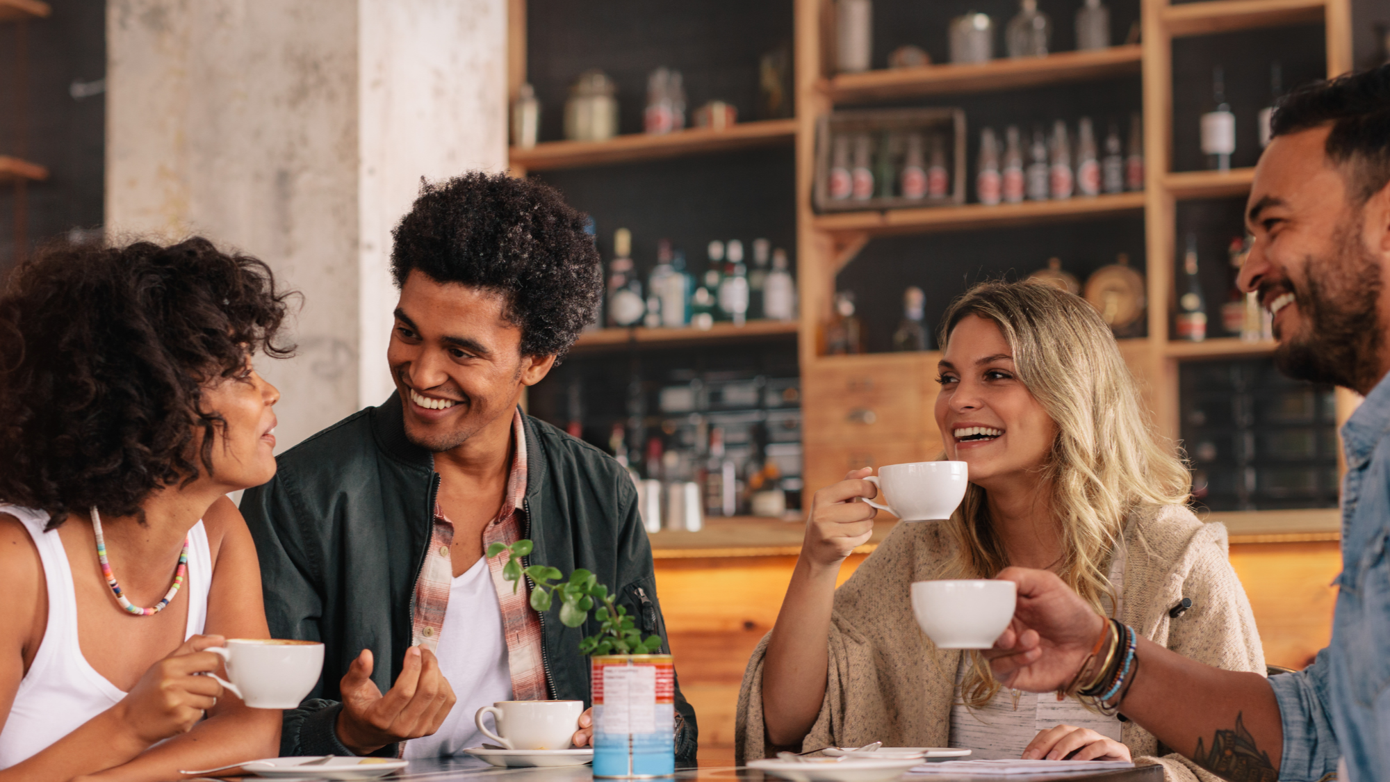 cognitive behavior therapy nyc, diverse group of New Yorkers discussing personal growth and challenges in coffee shop
