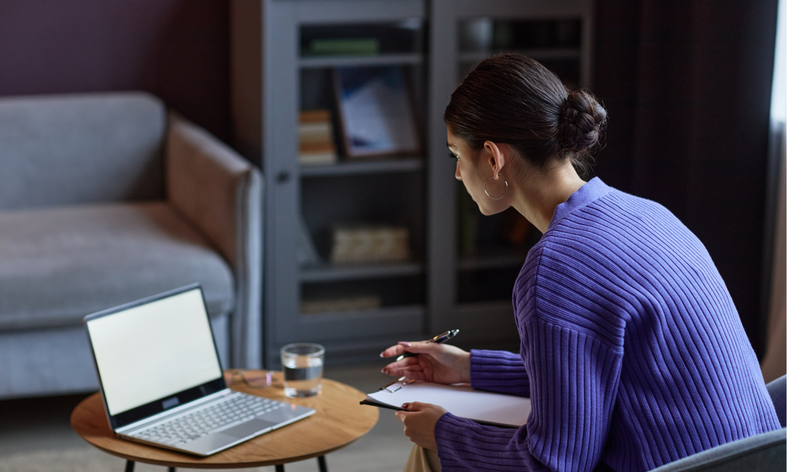 young woman, booking a therapist online
