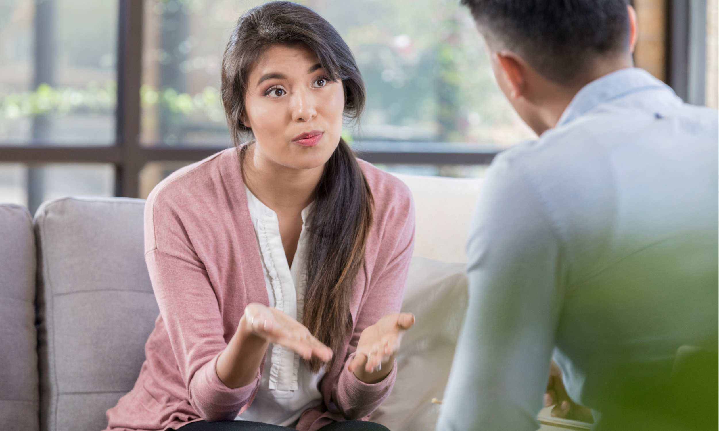 insightful therapist, empathetic expression, explaining therapy options for depression using visual aids in a calm therapy office.