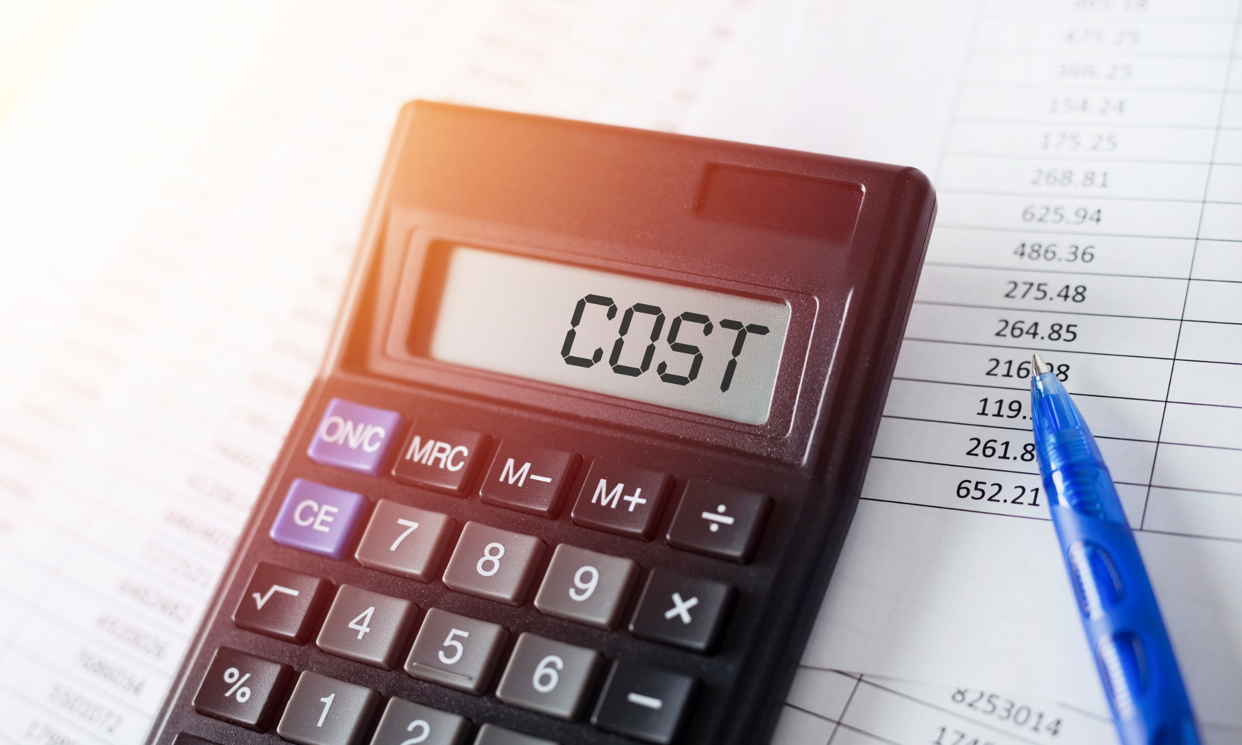 A calculator and a sheet of paper detailing therapy costs.